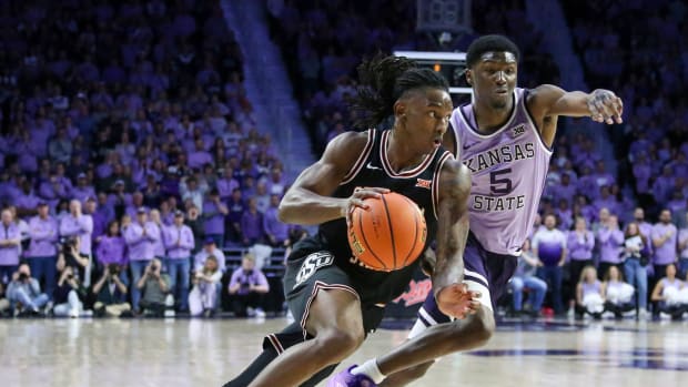 Jan 20, 2024; Manhattan, Kansas, USA; Oklahoma State Cowboys guard John-Michael Wright (51) dribbles against Kansas State Wildcats guard Cam Carter (5) during the second half at Bramlage Coliseum. Mandatory Credit: Scott Sewell-USA TODAY Sports